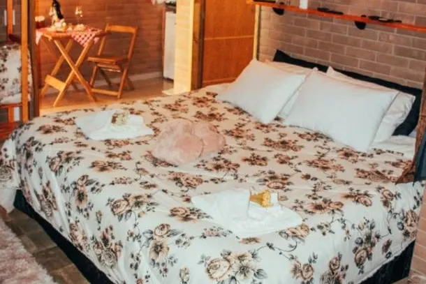 Quarto em Pousada Groms Village